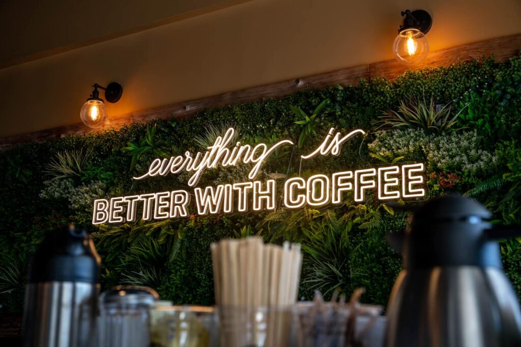 interior sign reading everything is better with coffee