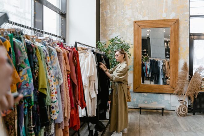 Woman looking at rack of clothes
