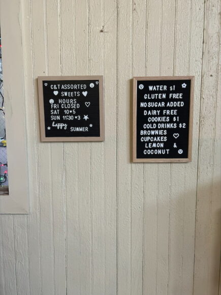 Letterboard bakery menus hanging on interior walls