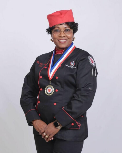 Owner of Olobe's Kitchen in chef's uniform