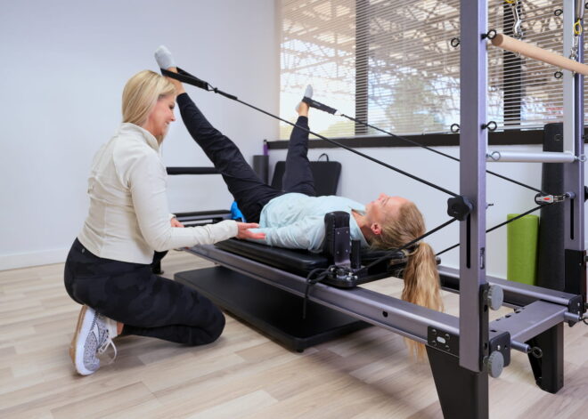 A patient of Actify Physiotherapy and Wellness working with the owner in a physical therapy session