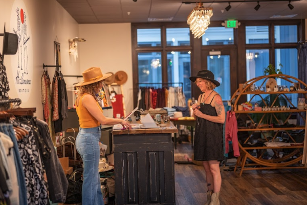 Two women at checkout counter at Hi-Lonesome Boutique