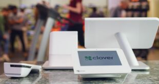 Clover point of sale equipment on counter facing customer