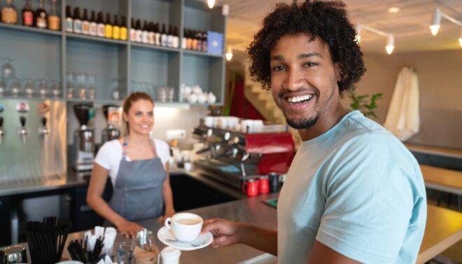 loyal customer drinking coffee at cafe counter