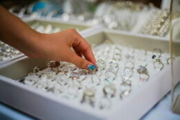Woman trying on rings in a jewelry shop